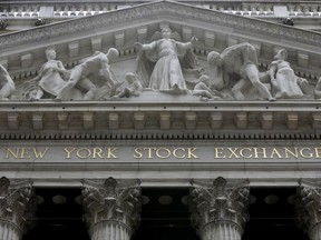 FILE - This Oct. 4, 2014, file photo, shows the facade of the New York Stock Exchange. U.S. stocks are quiet early Wednesday, Aug. 30, 2017, as technology companies rise while energy companies continue to fall as investors sort through the ongoing damage caused by Harvey. (AP Photo/Richard Drew, File)