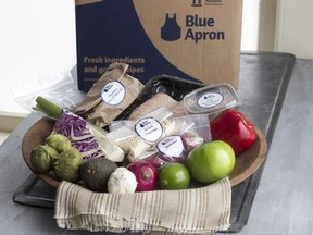 FILE - This Oct. 6, 2014, file photo shows an example of a home-delivered meal from Blue Apron. Blue Apron Holdings, Inc. reports earnings, Thursday, Aug. 10, 2017. (AP Photo/Matthew Mead, File)