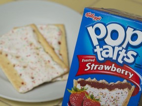 FILE - In this Monday, April 29, 2013, file photo, Kellogg's brand Strawberry flavored Pop-Tarts are arranged for a photo in Surfside, Fla. On Thursday, Aug. 3, 2017, Kellogg Co. reported second-quarter profit of $282 million. (AP Photo/Wilfredo Lee, File)