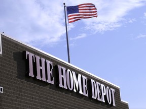 FILE - In this Wednesday, May 18, 2016, file photo, an American flag flies over a Home Depot store location, in Bellingham, Mass. The retailer made more in profit from May through July 2017 than any other quarter in its history, and its 14 percent rise in earnings per share was stronger than analysts expected. Home Depot at the same time raised its profit forecast for 2017 and reported higher revenue than Wall Street forecast. Even still, Home Depot's stock slid 2.7 percent after the report. (AP Photo/Steven Senne, File)