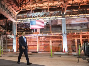 New York Gov. Andrew Cuomo arrives for a news conference at the Daniel Patrick Moynihan Train Hall construction site, Thursday, Aug. 17, 2017, in New York. Cuomo announced the start of major construction for a new, light-filled train hall across from the cramped and dark Penn Station. (AP Photo/Mary Altaffer)