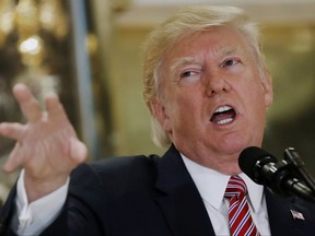 President Donald Trump speaks to the media in the lobby of Trump Tower in New York, Tuesday, Aug. 15, 2017. (AP Photo/Pablo Martinez Monsivais)