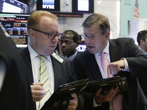 Traders work on the floor of the New York Stock Exchange