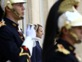 French President Emmanuel Macron, center, waits for leaders at the Elysee Palace in Paris, Monday, Aug.28, 2017. The leaders of France, Germany, Italy and Spain are meeting Monday with counterparts from Libya, Niger and Chad to discuss ways to curb illegal migration across the Mediterranean Sea to European shores. (AP Photo/Thibault Camus)