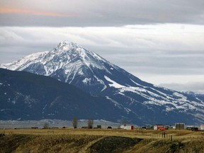 FILE - This Nov. 21, 2016, file photo shows Emigrant Peak towering over the Paradise Valley in Montana north of Yellowstone National Park, the day U.S. officials announced a ban on new mining claims across more than 30,000 acres in the area. U.S. Interior Secretary Ryan Zinke says he wants to speed up a proposal to block new gold mining claims on public lands near Yellowstone National Park and will consider blocking other types of mining. (AP Photo/Matthew Brown, File)