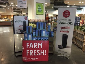 Amazon's Echo and Echo Dot appear on sale at a Whole Foods Market in New York, Monday, Aug. 28, 2017. Amazon has completed its $13.7 billion takeover of organic grocer Whole Foods, and the e-commerce giant is wasting no time putting its stamp on the company. Prices were lowered; Whole Foods brands will soon be on Amazon's site; and Amazon's Prime members could soon get discounts at Whole Foods. The deal could also spur changes in the wider grocery industry. (AP Photo/Joseph Pisani)
