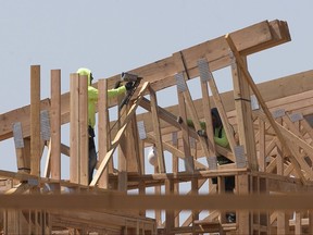 In this photo taken Friday, Aug. 18, 2017, builders work on an apartment complex in Sacramento, Calif. Gov. Jerry Brown and Democratic legislative leaders promised to tackle California's housing crisis in the final weeks of the legislative session by pushing a package that includes money for low-income housing and regulatory reforms. (AP Photo/Rich Pedroncelli)