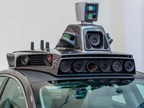 A pilot model of Uber’s self-driving car from 2016 shows the bulky apparatus. Magna says it can integrate that equipment into the body of the car.