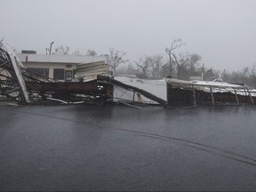 A gas station's awning blocks a street after Hurricane Harvey ripped through in Rockport, Texas, on Saturday, Aug. 26, 2017.