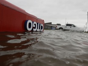 The roof of a gas station sits in flood waters in the wake of Hurricane Harvey on Saturday, Aug. 26, 2017, in Aransas Pass, Texas.