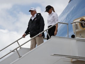 President Donald Trump and first lady Melania Trump arrive on Air Force One at Austin-Bergstrom International Airport in Austin, Texas, Tuesday, Aug. 29, 2017, wldfor briefings on Harvey relief efforts. (AP Photo/Evan Vucci)
