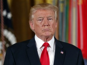 In this July 31, 2017, photo, President Donald Trump pauses during a ceremony in the East Room of the White House in Washington. Trump's threat to stop billions of dollars in government payments to insurers and force the collapse of "Obamacare" could put the government in a tricky legal situation. Legal experts say he'd be handing insurers a solid court case, while undermining his own leverage to compel Democrats to negotiate, especially if premiums jump by 20 percent as expected after such a move. (AP Photo/Pablo Martinez Monsivais)