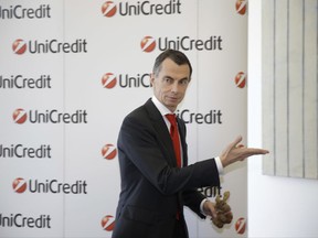 UniCredit Bank CEO, Jean Pierre Mustier arrives for a press conference in Milan, Italy, Thursday, Aug. 3, 2017.  UniCredit on Thursday reported second-quarter profits grew by 3 percent as the Italian bank undergoes a major turnaround under CEO Jean Pierre Mustier, who was appointed one year ago. (AP Photo/Luca Bruno)