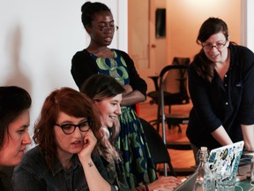 Undated handout showing Dames Making Games members at an event in Toronto.