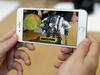 An iPhone 8 runs an augmented reality app.
