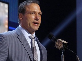 FILE - In this May 1, 2015, file photo, Chris Spielman speaks at the 2015 NFL Football Draft in Chicago. Ohio State asked a judge on Monday, Sept. 18, 2017, to throw out a lawsuit filed against it by the former All-American and All-Pro linebacker earlier in the summer. The class-action antitrust lawsuit alleges the university used athletes' photos without permission and compensation, and is asking the marketing programs be stopped and the ex-athletes be compensated. The university argued it is not a matter for the federal courts, and that Spielman hasn't met the legal burden required in antitrust lawsuits. (AP Photo/Charles Rex Arbogast, File)