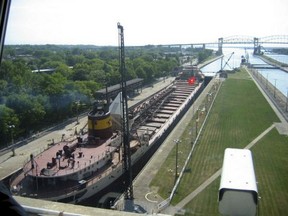 In this June 10, 2005 an ore ship passes through the Soo Locks in Sault Ste. Marie, Mich. Vessels large and small pass through the structures known as the Soo Locks more than 7,000 times a year. Officials from the Great Lakes states are making renewed push to win approval of a long-stalled proposal for adding a new lock to the Soo Locks complex, a critical chokepoint that connects Lake Superior to the lower Great Lakes. Only one of the two working locks there handles large iron ore boats. (AP Photo/John Flesher)