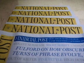 Copies of the Postmedia-owned newspaper National Post are displayed at a hotel in Burnaby, B.C., on Tuesday, January 19, 2016. Workers at Postmedia's National Post newspaper have announced plans to try to form a union. THE CANADIAN PRESS/Darryl Dyck