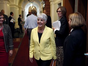 B.C. Finance Minister Carole James leaves the legislative assembly after delivering the budget from the legislative assembly at Legislature in Victoria, B.C., on Monday, September 11, 2017. British Columbia's three-member Green party was a factor behind the absence of big-ticket election promises in the minority NDP government's first budget update, Finance Minister Carole James says. THE CANADIAN PRESS/Chad Hipolito