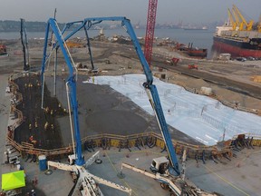 Construction crews work on building a new G3 Canada grain terminal in Vancouver.