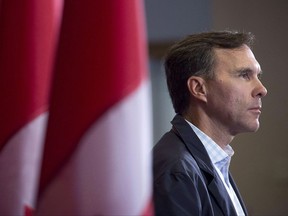 Finance Minister Bill Morneau takes questions as the Liberal cabinet meets in St. John's, N.L. on Tuesday, Sept. 12, 2017. Finance Minister Bill Morneau is putting the squeeze on federal New Democrats, chiding them for failing to support his proposals to end what he calls unfair tax advantages for some wealthy small business owners. In a letter to three New Democrat MPs, Morneau says he was surprised to receive a letter from them indicating that the NDP -- normally a champion of reducing income inequality -- supports "continued tax advantages for the wealthiest Canadians." THE CANADIAN PRESS/Andrew Vaughan