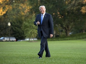 President Donald Trump walks from Marine One across the South Lawn of the White House in Washington, Wednesday, Sept. 27, 2017, as he returns from Indianapolis. (AP Photo/Carolyn Kaster)