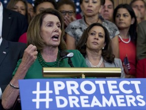 House Minority Leader Nancy Pelosi of Calif. accompanied by members of the House and Senate Democrats, gestures during a news conference on Capitol Hill in Washington, Wednesday, Sept. 6, 2017. House and Senate Democrats gather to call for Congressional Republicans to stand up to President Trump's decision to terminate the Deferred Action for Childhood Arrivals (DACA) initiative by bringing the DREAM Act for a vote on the House and Senate Floor. ( AP Photo/Jose Luis Magana)