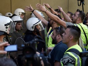 Dozens of Eldorado Gold workers clashed with police outside the energy ministry on Wednesday in protest at potential job losses.