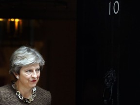 British Prime Minister Theresa May walks out at 10 Downing Street to meet European Council President Donald Tusk in London, Tuesday, Sept. 26, 2017.(AP Photo/Frank Augstein)