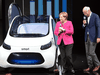 Angela Merkel and Dieter Zetsche at the Frankfurt Auto Show last earlier this month. German automakers risk being overtaken by the electric vehicle push.