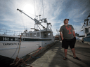 John Symonds stands on the dock in Woods Harbour, NS. John was a good friend of Katlin