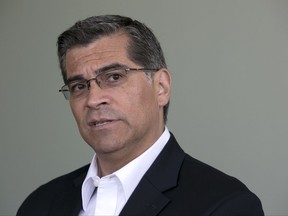 FILE - In this June 9, 2017 file photo, California Attorney General Xavier Becerra is shown during an interview in Sacramento, Calif. Gatorade has agreed not to make disparaging comments about water as part of a $300,000 settlement reached Thursday, Sept. 21, 2017, with California over allegations it misleadingly portrayed waters' benefits in a cellphone game where users refuel Olympic runner Usain Bolt. The dispute between the sports-drink company and California Attorney General Xavier Becerra was settled in less than day after Becerra filed a complaint in Los Angeles County. (AP Photo/Rich Pedroncelli, File)