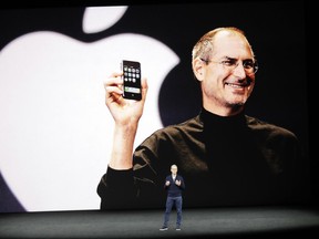 Apple CEO Tim Cook kicks off the event for a new product announcement at the Steve Jobs Theater on the new Apple campus on Tuesday in Cupertino, Calif.