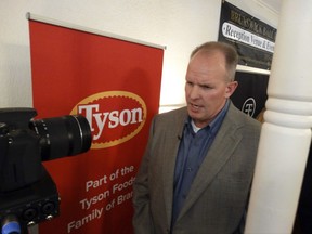 Doug Ramsey, group president of poultry for Tyson Foods Inc., answers questions from reporters about the company's plans to build a $320 million chicken-processing plant, Tuesday, Sept. 5, 2017, in Tonganoxie, Kan. The company expects the plant to employ 1,600 workers processing as many as 1.25 million birds per week. (Peter Hancock/The Journal-World via AP)