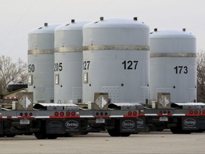 FILE - In this on March 6, 2014 file photo, empty nuclear waste shipping containers sit in front of the Waste Isolation Pilot Plant near Carlsbad, N.M. A government watchdog agency says the United States' only underground repository for nuclear waste doesn't have enough space for the radioactive debris left over from decades of bomb-making and nuclear research, much less tons of surplus weapons-grade plutonium. The U.S. Government Accountability Office found that officials with the U.S. Energy Department have not analyzed or planned for expanding the Waste Isolation Pilot Plant in southern New Mexico and that regulatory approval for doing so would take years. (AP Photo/Susan Montoya Bryan, File)