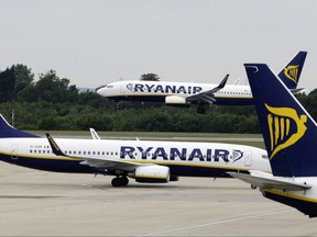 FILE - This Tuesday July 21, 2009 file photo, shows Ryanair planes at Stansted Airport in England. Irish budget airline Ryanair is under pressure to provide more information to travelers, on Monday Sept. 18, 2017, after canceling up to 50 flights a day over the next six weeks because it "messed up" its pilots' holiday schedules. (AP Photo/Matt Dunham, File)