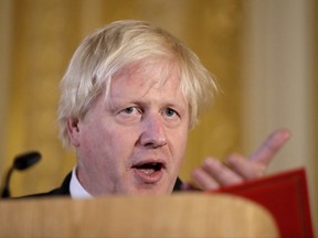 Britain's Foreign Secretary Boris Johnson answers a journalist's question on Myanmar as he and U.S. Secretary of State Rex Tillerson hold a press conference after their meeting on Libya at Lancaster House in London, Thursday, Sept. 14, 2017. (AP Photo/Matt Dunham, Pool)