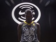 Golden State Warriors' Kevin Durant wears one of the new NBA league jerseys from Nike, which replaced Adidas with this partnership