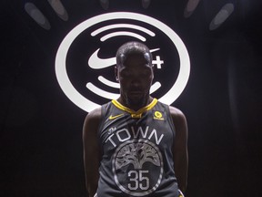 Golden State Warriors' Kevin Durant wears one of the new NBA league jerseys from Nike, which replaced Adidas with this partnership