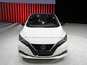 The 2018 Nissan Leaf is on display during an unveiling event Tuesday, Sept. 5, 2017, in Las Vegas. Japanese automaker Nissan Motor Co. unveiled its zero-emissions vehicle in the U.S. late Tuesday. (AP Photo/John Locher)