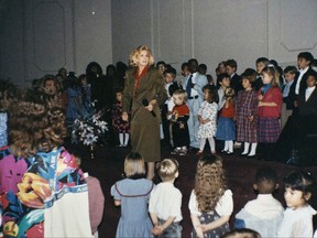 This undated photo provided in 2017 by a former member of the Word of Faith Fellowship shows founder Jane Whaley with children at the church in Spindale, N.C. Former members of the evangelical church say Whaley coerced congregants into filing false unemployment claims after the faltering economy threatened weekly tithes from church-affiliated companies. (AP Photo)