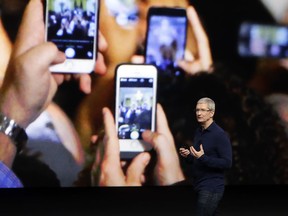 Apple CEO Tim Cook announces the iPhone 7 during an event in San Francisco.