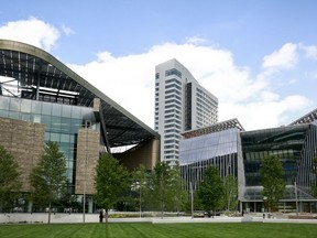 This Wednesday Aug. 16, 2017, photo shows the main buildings of Cornell Tech - the main academic building called the Bloomberg Center, left, a 26-story residence hall, center, and a programs building called the Bridge, right, on Roosevelt Island in New York. The first three buildings of a 12-acre campus on Roosevelt Island are officially opening Wednesday, Sept. 13, after a fledgling Cornell Tech program spent the past four years as a rent-free tenant at a Google office building in Manhattan. (AP Photo/Bebeto Matthews)