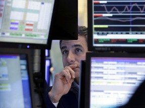 FILE - In this Tuesday, Jan. 24, 2017, file photo, specialist Anthony Rinaldi works at his post on the floor of the New York Stock Exchange. On Thursday, Sept. 21, 2017, the Federal Reserve reports on household wealth for the April-June quarter. (AP Photo/Richard Drew, File)