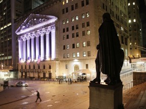 FILE - In this Wednesday, Oct. 8, 2014, file photo, a statue of George Washington stands near the New York Stock Exchange, in background. U.S. stocks are lower early Thursday, Sept. 28, 2017, as technology companies decline and smaller companies slip after a rally brought them to record highs. Drug and medical device maker Abbott Laboratories is climbing after regulators approved its new blood glucose monitoring system for diabetes patients. Energy companies are higher as the price of oil rises. (AP Photo/Mark Lennihan, File)