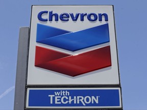 FILE - This Tuesday, May 2, 2017, file photo shows a Chevron sign at a gas station in Miami. On Thursday, Sept. 28, 2017, Chevron Corp. announced it is naming Michael K. Wirth chairman and chief executive to replace John S. Watson, who is retiring after spending 37 years with the energy company. The changes are effective Feb. 1, 2018. (AP Photo/Alan Diaz)