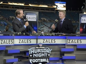 FILE - In this Nov. 19, 2015, file photo, Thursday Night Football sportscasters Bill Cowher, left, and Phil Simms broadcast from the set on the field before an NFL football game between the Jacksonville Jaguars and the Tennessee Titans in Jacksonville, Fla.   Every NFL football game will be shown live online this 2017-18 season, but that doesn't mean you can watch. (AP Photo/Phelan M. Ebenhack, File)