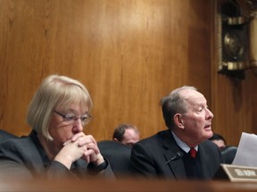 FILE- In this Jan. 31, 2017, file photo, Senate Health, Education, Labor, and Pensions Committee Chairman Sen. Lamar Alexander, R-Tenn., accompanied by the committee's ranking member Sen. Patty Murray, D-Wash. speaks on Capitol Hill in Washington during the committee's executive session to discuss the nomination of Education Secretary Betsy DeVos. Congress is at a crossroads after Senate GOP leaders announced on Tuesday, Sept. 26, that they would not take their latest repeal of Barack Obama's health care law bill to the floor for lack of support. Alexander said he would resume efforts to reach a bipartisan deal with Murray to stabilize markets for individual insurance policies that 18 million people rely on. (AP Photo/Alex Brandon, File)