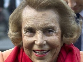 FILE - In this March 29, 2012 file photo, L'Oreal heiress Liliane Bettencourt leaves the L'Oreal-UNESCO prize for the women in science, in Paris, France. L'Oreal cosmetics heiress Liliane Bettencourt has died at the age of 94 at her home, her family announced. (AP Photo/Thibault Camus, File)
