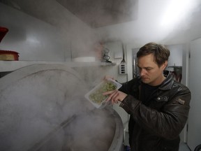 In this picture taken on Saturday, Sept. 2, 2017 Vit Spacil, co-owner of a smart mobile brewery, brews beer inside the container at a garden in Prague, Czech Republic. The container brewery is capable of making 525 hectoliters a year. The point is not the quantity but the quality and in that it is reflecting a growing appetite of consumers for craft beers. (AP Photo/Petr David Josek)